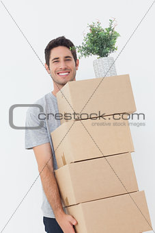 Man carrying boxes because he is moving