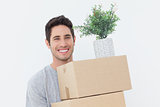 Man holding boxes because he is moving