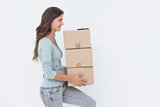 Woman holding boxes because she is moving in a new house