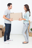 Woman and her husband holding a box