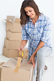 Woman wrapping a box