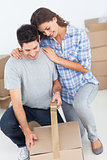 Woman and man wrapping a box