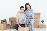 Portrait of a woman and her husband wrapping a box