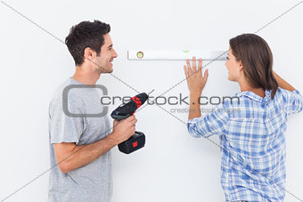 Man and his wife doing diy together