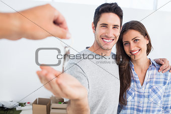 Happy man being given a house key