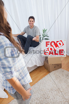 Man chatting with his wife in his new house