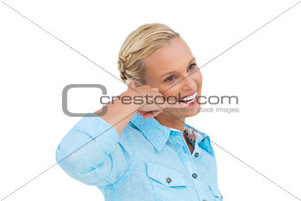 Attractive blonde doing a symbol of phone with her hand and looking something