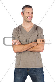 Handsome man smiling with arms crossed