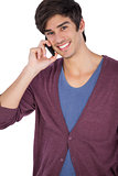 Smiling young man with mobile phone