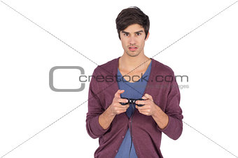 Young man concentrated on video games