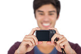 Young man taking picture of himself