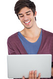 Laughing man using a laptop
