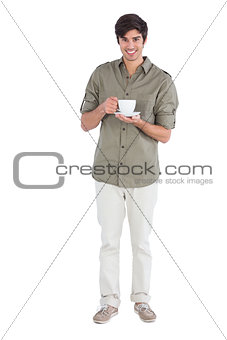 Happy man holding cup of coffee