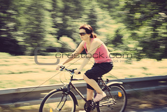 pretty woman riding a bicycle