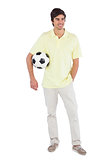 Happy man holding soccer ball