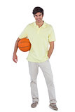 Young man holding basket ball