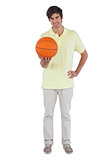 Smiling man holding a basket ball