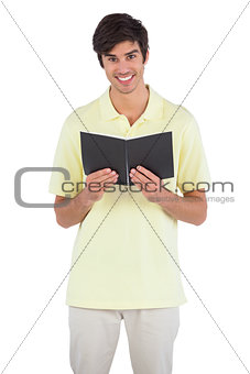 Student holding notebook