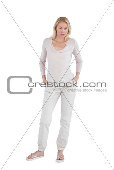 Concentrating woman with hands in pockets