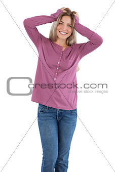 Happy woman with hands on head