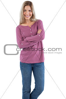 Smiling woman with arms crossed