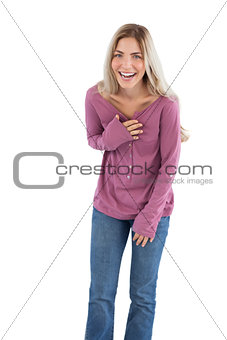 Young woman laughing while looking at the camera