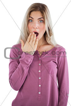 Surprised woman with hand on mouth