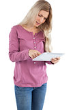 Worried woman using a tablet pc