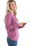 Profile view of a woman using tablet pc