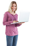 Smiling woman using laptop