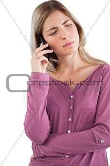 Worried woman talking on the phone