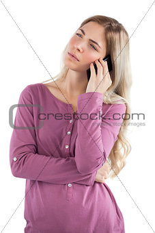 Thoughtful woman on the phone