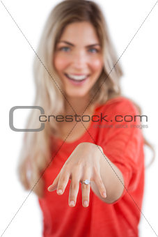 Young woman showing her engagement ring