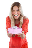 Young woman offering gift