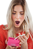 Shocked woman discovering necklace in a gift box