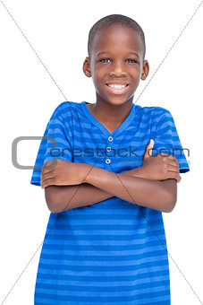Cheerful boy with arms crossed