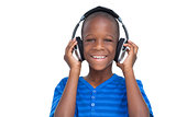 Happy little boy listening to music