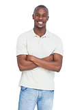 Smiling man posing with arms crossed