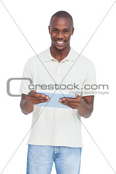 Happy man holding a tablet pc