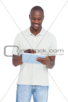Smiling man using tablet pc
