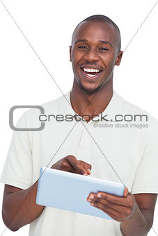 Portrait of a laughing man with tablet pc