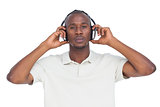 Concentrated man listening to music