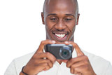 Smiling man taking picture
