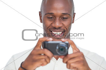 Smiling man taking picture