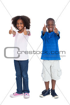 Brother and sister with thumbs up