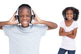 Brother and sister listening to music