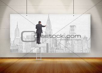 Businessman standing on ladder and drawing a city on a poster hung