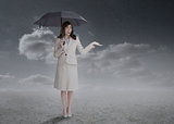 Businesswoman holding an umbrella