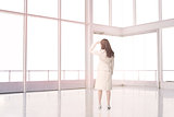 Businesswoman standing in an empty room