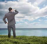 Stylish businessman looking at the sea